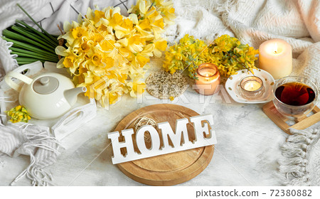 Spring still life with a Cup of tea and flowers . Spring still life with a Cup of tea and flowers . 72380882