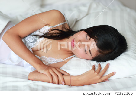young and sexy woman fall asleep on bed room young and sexy woman fall asleep on bed room 72382160