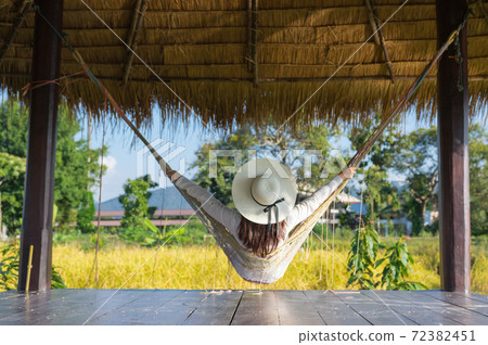Relaxing hanging on  hammock. 72382451