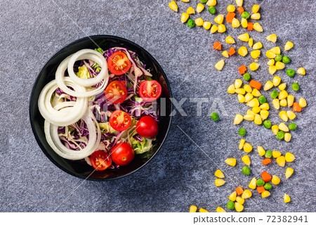 salad bowl with tomatoes fresh mixed leaves vegetable in a dish salad bowl with tomatoes fresh mixed leaves vegetable in a dish 72382941