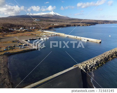 Aerial view of Honbetsu fishing port in Shikabe-cho, Hokkaido in early winter 72383145