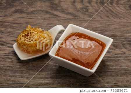 Natural honey in the bowl Natural honey in the bowl 72385671