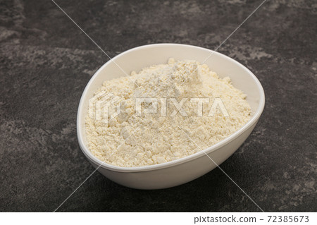 Wheat flour heap in the bowl Wheat flour heap in the bowl 72385673