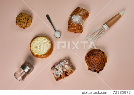 Set of pastries on a pink background, top view Set of pastries on a pink background, top view 72385972
