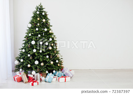 New Year presents christmas tree decor interior of the house New Year presents christmas tree decor interior of the house 72387397