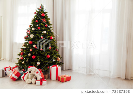 New Year presents christmas tree decor interior of the house New Year presents christmas tree decor interior of the house 72387398