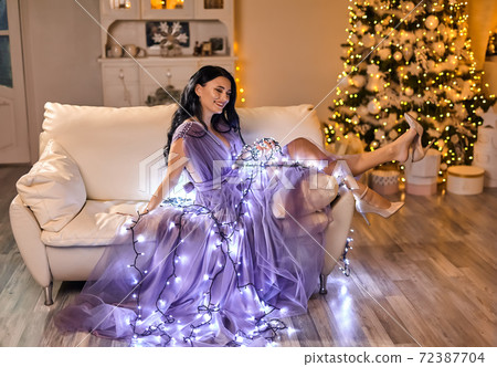 beautiful pretty woman wearing elegant dress posing in christmas interior beautiful pretty woman wearing elegant dress posing in christmas interior 72387704