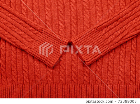 Background texture of red knitted wool fabric Background texture of red knitted wool fabric 72389003