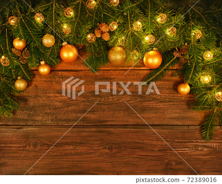 Christmas tree with lights and balls over wood Christmas tree with lights and balls over wood 72389016