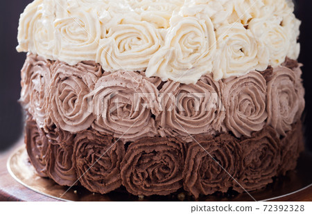 Birthday cake decorated with three chocolate cream roses Birthday cake decorated with three chocolate cream roses 72392328