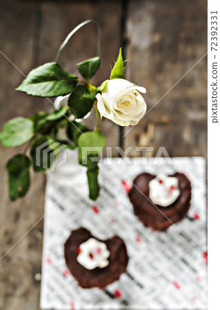 cakes in the form of heart and a white rose 72392331