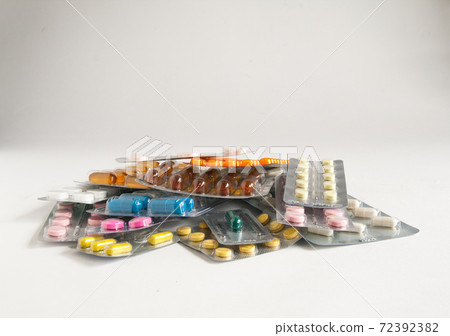 Stack of pills on a white background Stack of pills on a white background 72392382