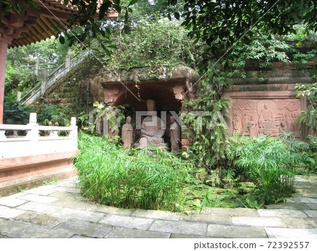 Buddha statue in a garden in the mountains Buddha statue in a garden in the mountains 72392557