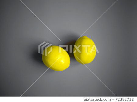 color concept of 2021. illuminating lemons on a ultimate gray background color concept of 2021. illuminating lemons on a ultimate gray background 72392738