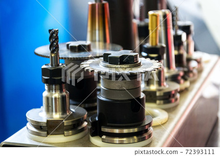 Automation and industry 4.0 concept with modern CNC milling machine cutters detail Automation and industry 4.0 concept with modern CNC milling machine cutters detail 72393111