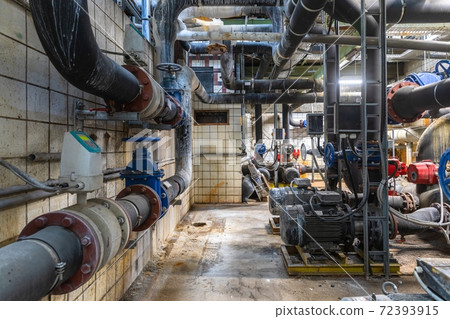 Boiler room full of pipes Boiler room full of pipes 72393915