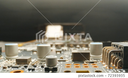 Motherboard close up photo with transistors 72393935