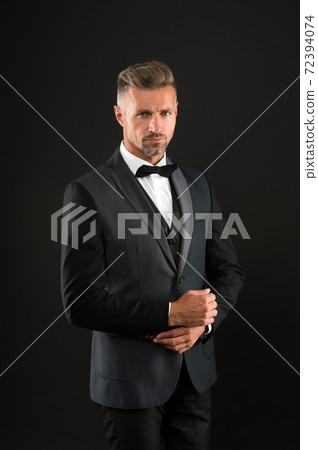 Handsome groom man wear tuxedo black background, wedding day concept 72394074