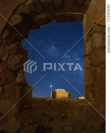Old village ruins under Milky Way 72394840