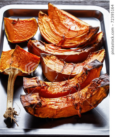 sliced butternut squash roasted in an oven sliced butternut squash roasted in an oven 72395164