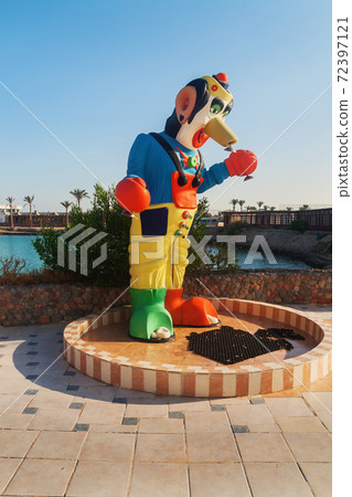 shower in the form of a clown by the pool 72397121