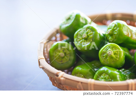 Ragged peppers in a basket 72397774