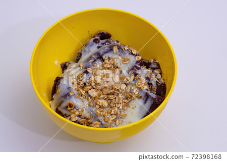 Acai in a yellow pot Acai in a yellow pot 72398168