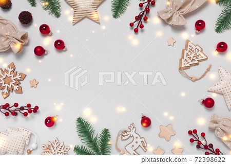 Christmas frame with decorations on white background Christmas frame with decorations on white background 72398622