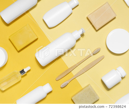 Cosmetic mock up pattern on yellow background Cosmetic mock up pattern on yellow background 72398624