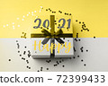 Gift on gray and illuminating yellow. Happy 2021 72399433