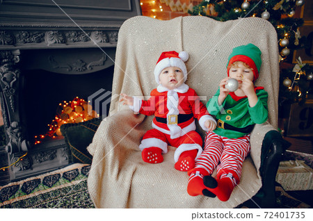Cutte little brothers at home near christmas decorations 72401735