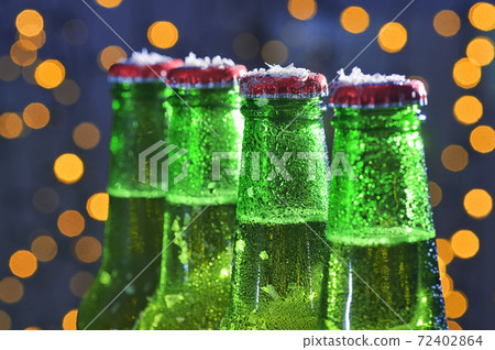 Green Bottle Of Beer and Holiday Glitter Background Green Bottle Of Beer and Holiday Glitter Background 72402864