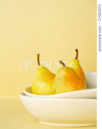 Harvested organic ripe yellow pears. 72402872