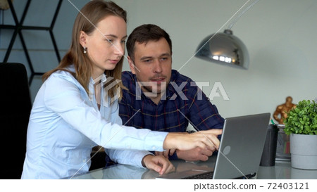 Group of business people and software developers working as a team in office 72403121