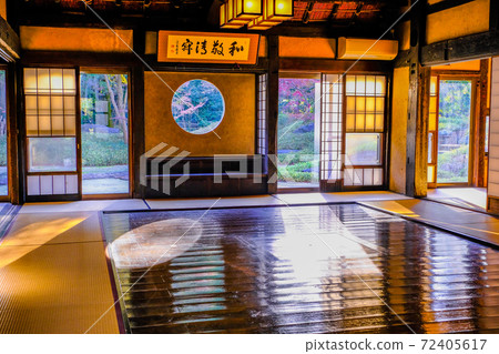 Round window of an old folk house 72405617