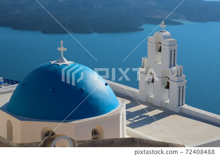 A blue-roofed church in the Aegean Sea (Santorini) 72408488