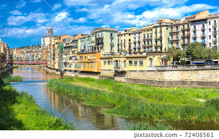 Colorful houses and Eiffel bridge in Girona Colorful houses and Eiffel bridge in Girona 72408561