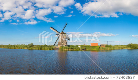 Windmills and canal in Kinderdijk 72408657