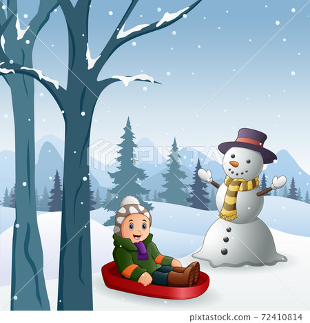 Children playing sledding in the snow 72410814