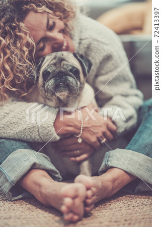 Love and friendship concept with happy defocused caucasian adult woman hug her lovely old dog pug - animal therapy and best friend together forever Love and friendship concept with happy defocused caucasian adult woman hug her lovely old dog pug - animal therapy and best friend together forever 72413397