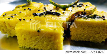Closup shot of gujarati Khaman Dhokla or Steamed Gram Flour Snack 72413692