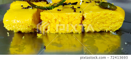 Closup shot of gujarati Khaman Dhokla or Steamed Gram Flour Snack Closup shot of gujarati Khaman Dhokla or Steamed Gram Flour Snack 72413693