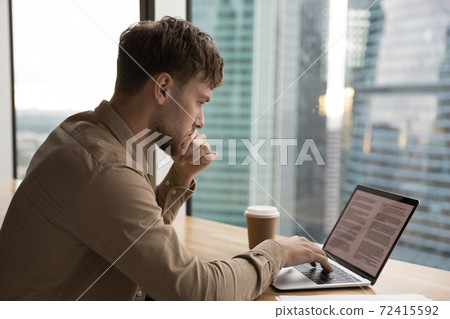 Pensive young man work on laptop thinking Pensive young man work on laptop thinking 72415592