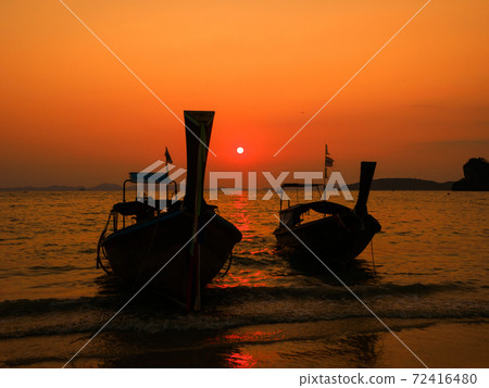 Long tail boat on the coast at dusk (West Railay Beach, Krabi Province, Kingdom of Thailand) 72416480