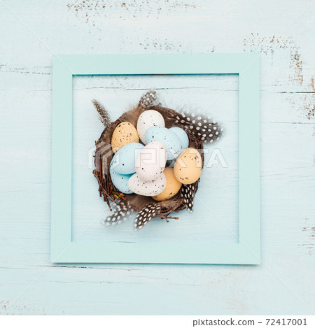 Easter craft eggs and branches on blue pastel background with space for text. Flat lay image composition, top view. 72417001