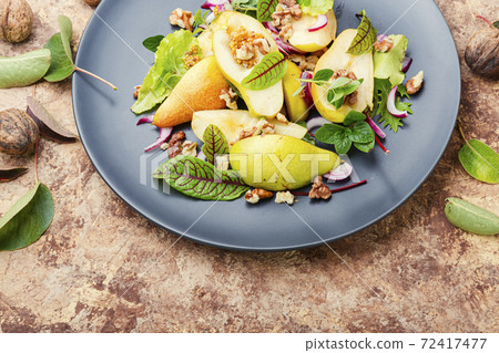 Healthy vegetarian salad with pear. 72417477