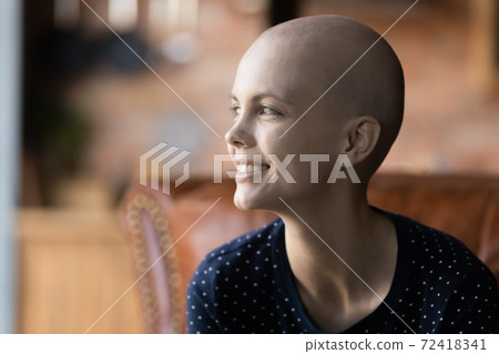 Close up profile smiling hairless woman looking to aside 72418341