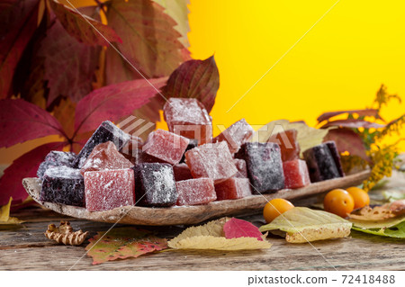 Homemade marmalade and autumn leaves. 72418488