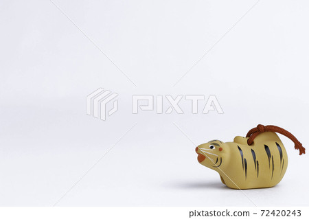 Tiger year of the zodiac, tiger figurine on a white background Tiger year of the zodiac, tiger figurine on a white background 72420243