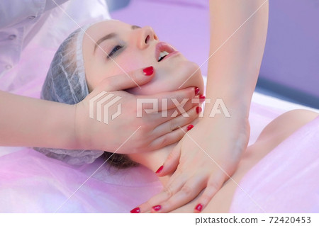Beautician massagist doctor making myoplastic neck massage to young woman. 72420453